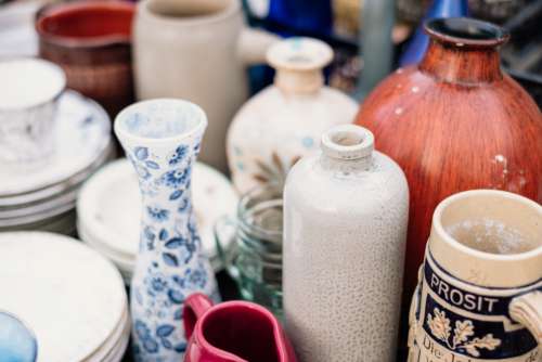 Old vintage ceramic pots and vases at a flea market 4