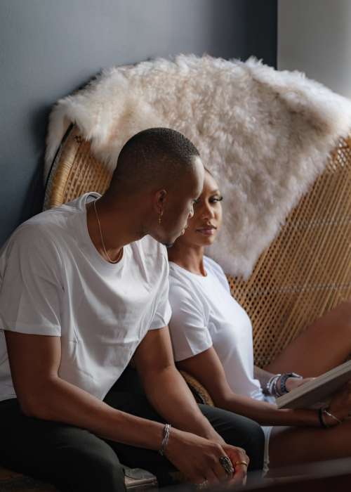 Two People In White Shirts Look At Each Other Photo