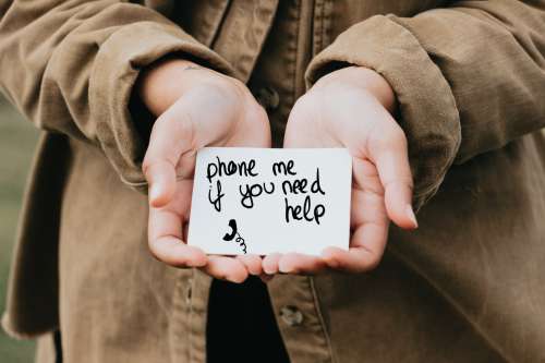 Hands Cup White Paper That Reads Phone Me If You Need Help Photo