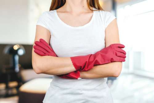 Confident Woman in Cleaning Gloves Ready for Housework